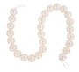 Round pearl garland strand with soft luster, strung on white cord with looped ends