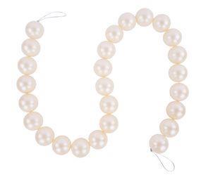 Round pearl garland strand with soft luster, strung on white cord with looped ends