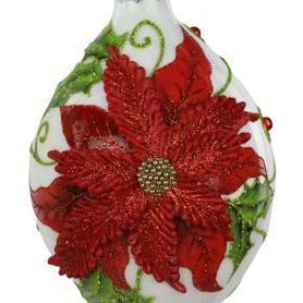 A white Christmas ornament shaped like a teardrop, featuring a large red poinsettia flower with green leaves and a silver hanging cap.