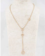 A gold-toned lariat necklace displayed on a textured cream-colored mannequin bust. The necklace features a fine chain, a central Y-shaped drop with three interlocking circular links, and two smaller circular links on the upper strap.