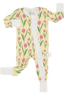 Floral patterned baby onesie with a zipper on a white background