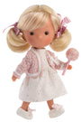 Doll with blonde hair in pigtails, wearing a white dress with pink accents and holding a pink toy.