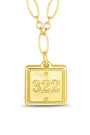 Gold pendant with the number 322 on a white background
