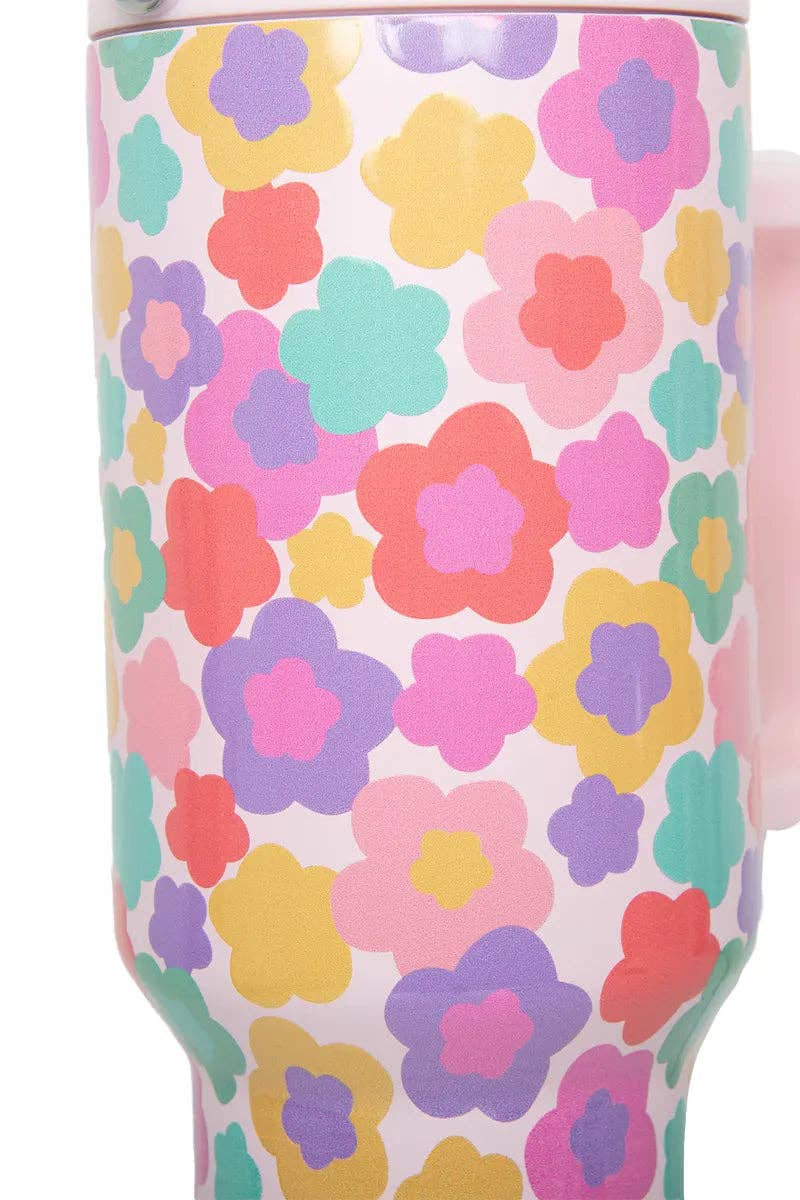 Tumbler with colorful floral pattern on a white background
