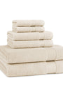 Stack of beige towels on a white background