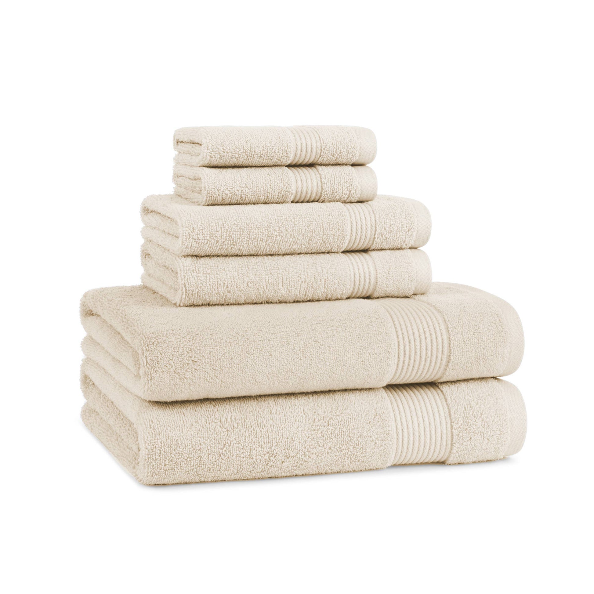 Stack of beige towels on a white background