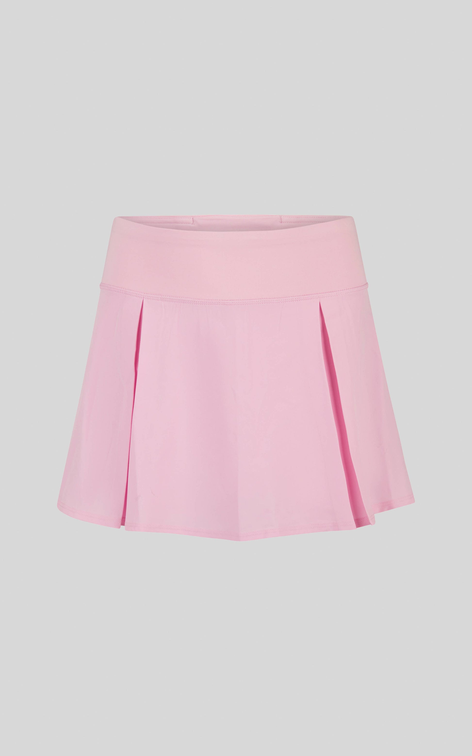 Pink pleated skirt on a light gray background