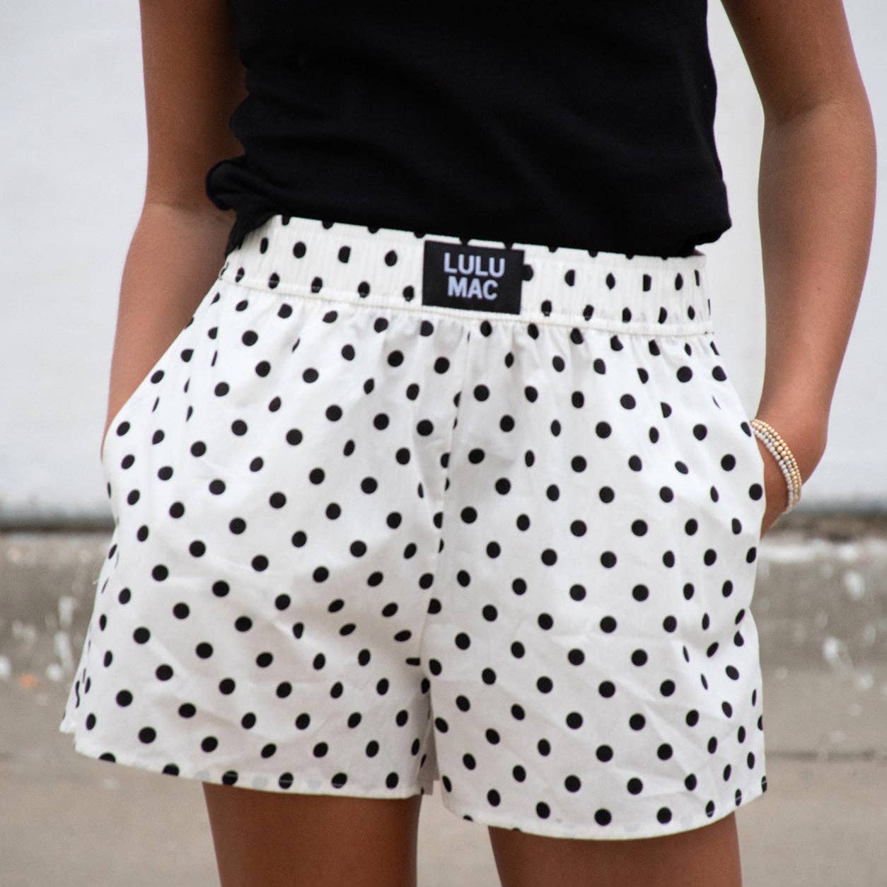 Girls polka dot shorts with elastic waist, white with black dots