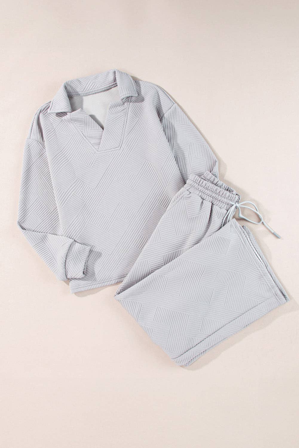 Light blue pajama set on a beige background