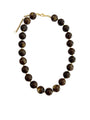 Brown chunky beaded necklace with round dark-brown beads and gold-tone chain links.