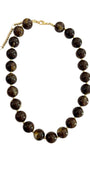 Brown chunky beaded necklace with round dark-brown beads and gold-tone chain links.