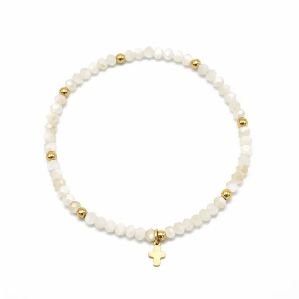 Bracelet with white beads and gold accents on a white background