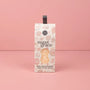Box of 'sweet grace' body wash sponge on a pink background