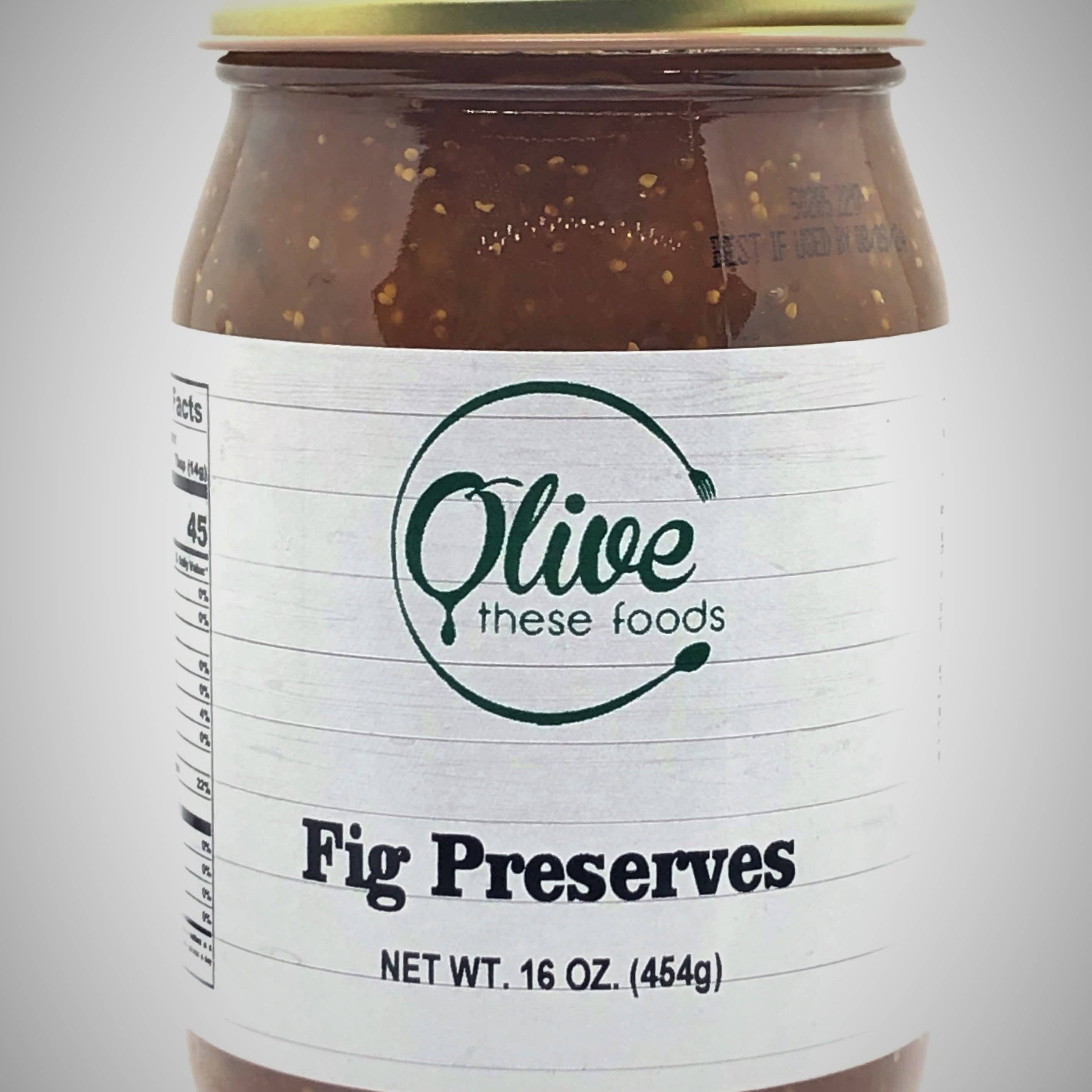 Jar of fig preserves with a visible label on a gray background