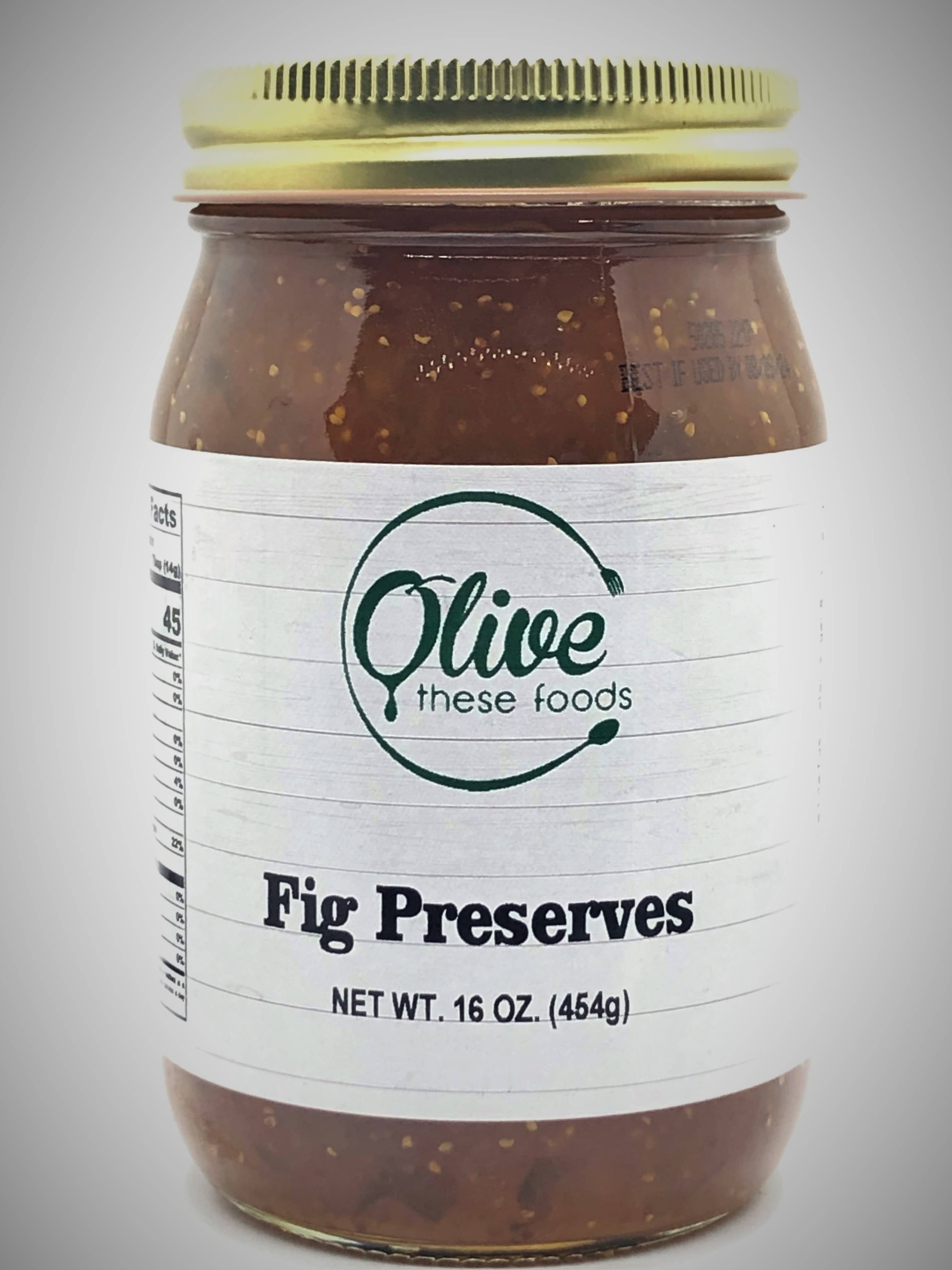 Jar of fig preserves with a visible label on a gray background