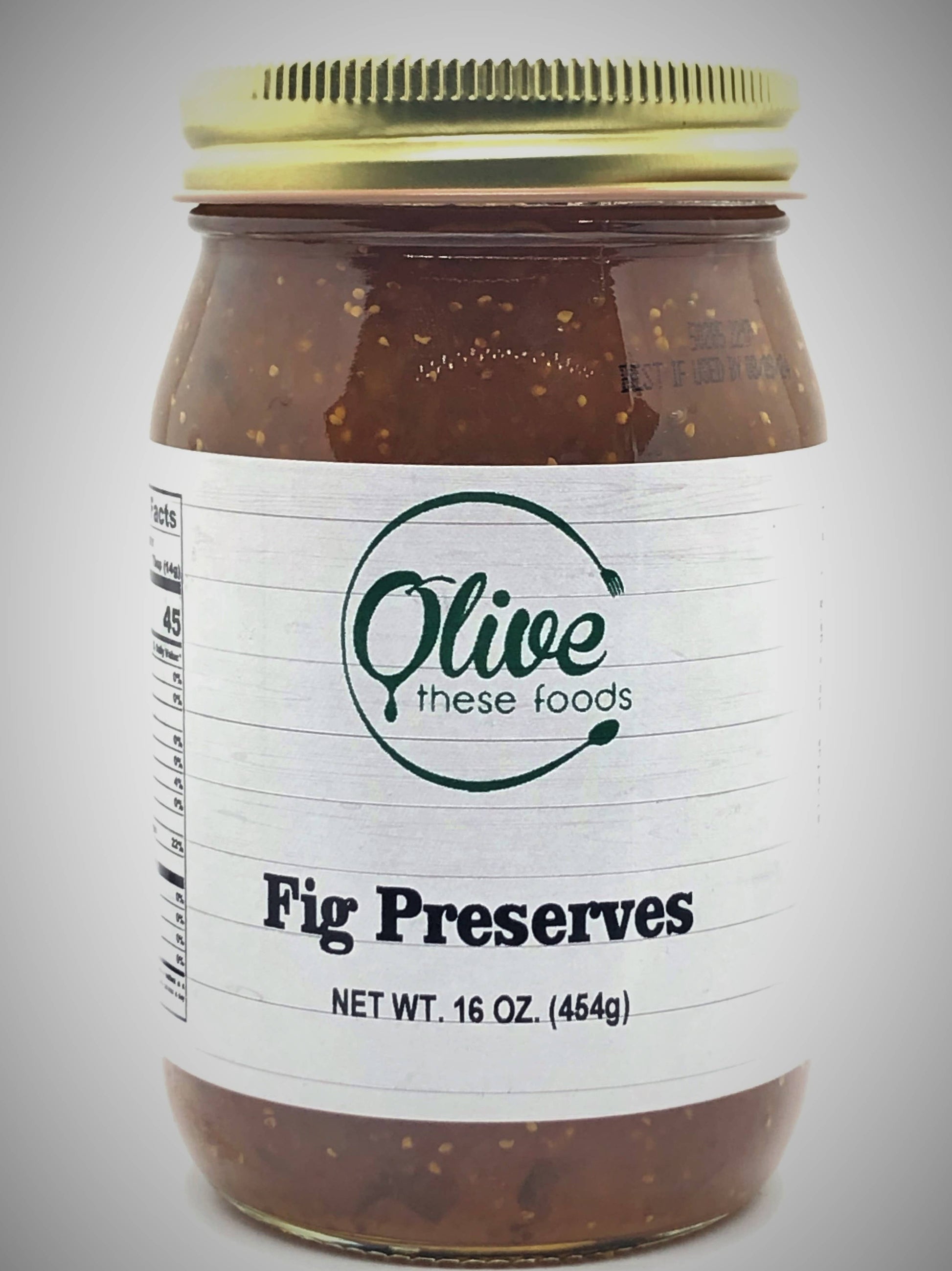 Jar of fig preserves with a visible label on a gray background