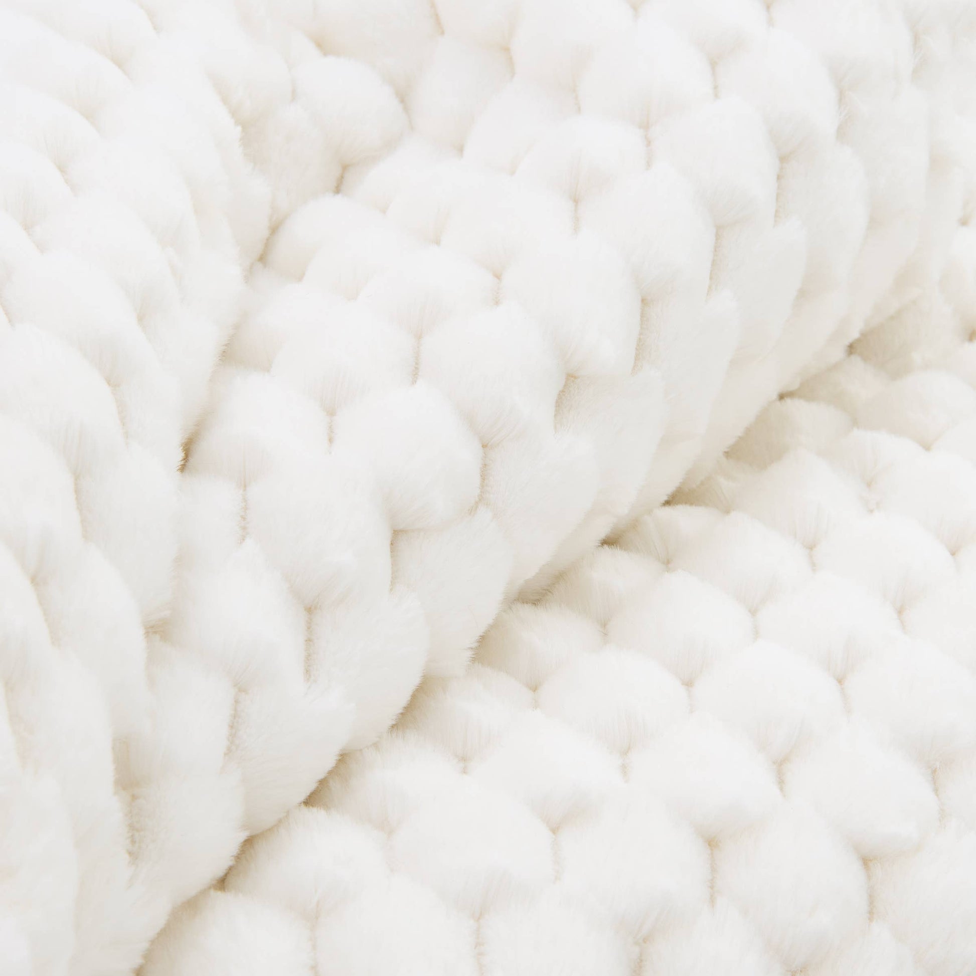 Close-up of white yarn with a textured pattern