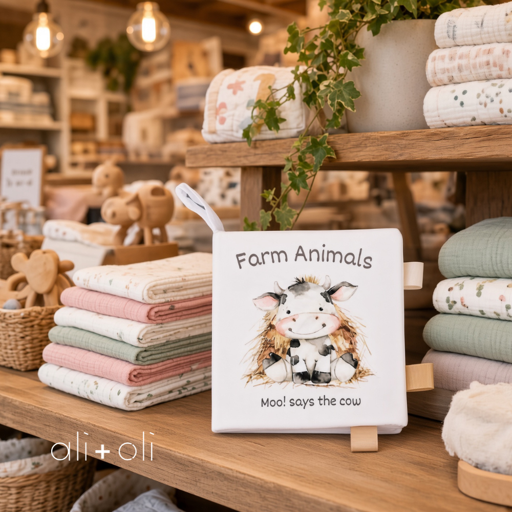 Soft crinkle farm animals cloth baby book on display with attached fabric ribbon tags
