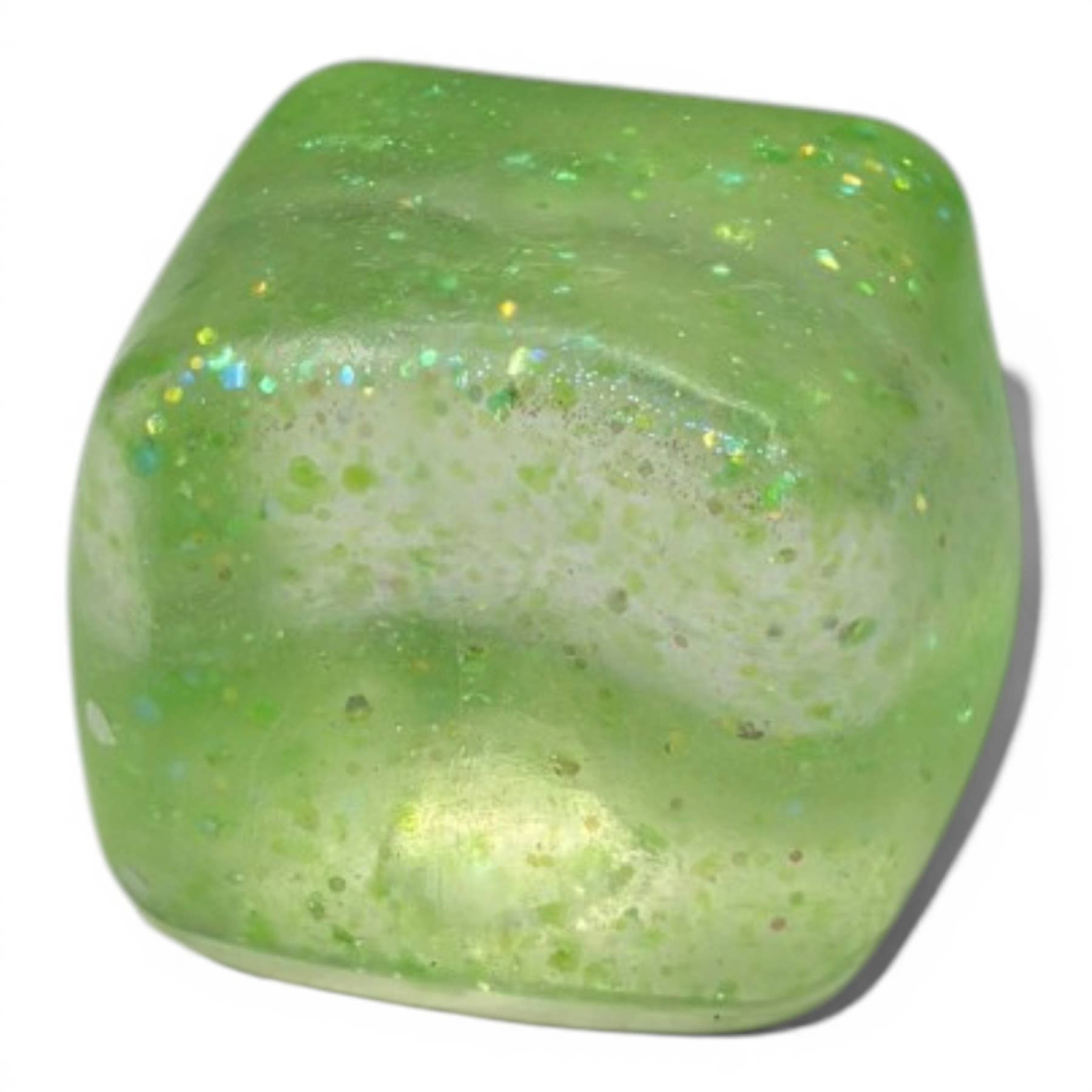 Green glittery cube on a white background