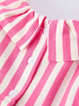 Close-up of a pink and white striped garment with buttons.