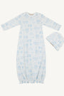 Baby gown with blue floral pattern and matching hat on a white background
