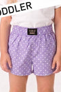 Purple polka dot shorts with a visible brand label on a white background, labeled 'TODDLER'.