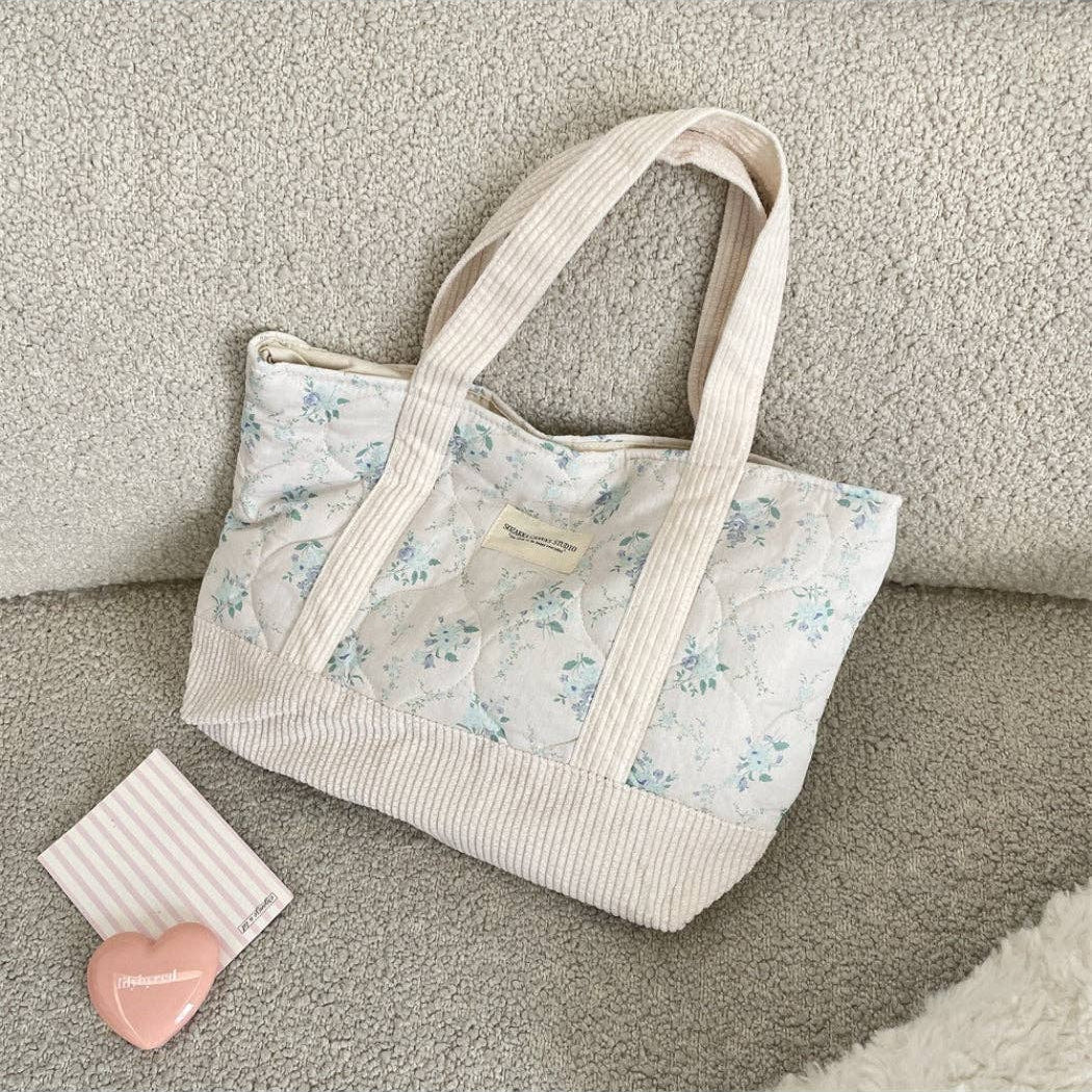 Quilted floral tote bag, light blue flower print with cream striped sides and handles