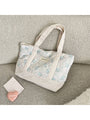 Quilted floral tote bag, light blue flower print with cream striped sides and handles