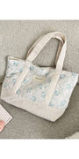 Quilted floral tote bag, light blue flower print with cream striped sides and handles