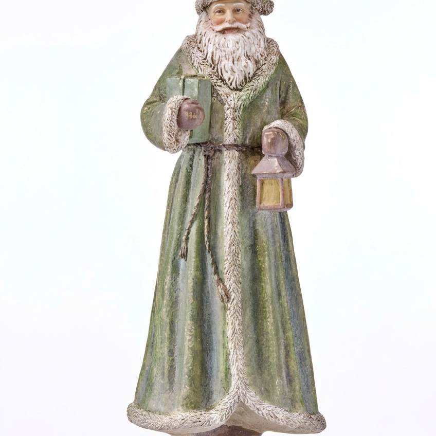 Antique resin Santa figurine holding a lantern, green robe with textured trim.