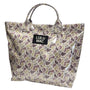 Patterned tote bag with 'LULU MAC' label on a white background