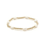 Bracelet with gold beads and pearls on a white background