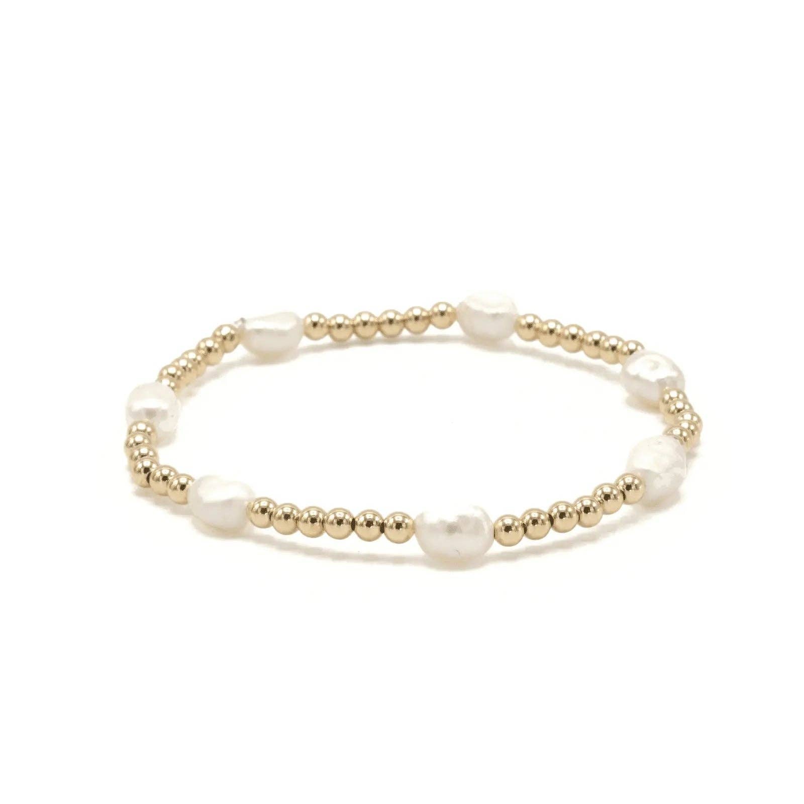 Bracelet with gold beads and pearls on a white background