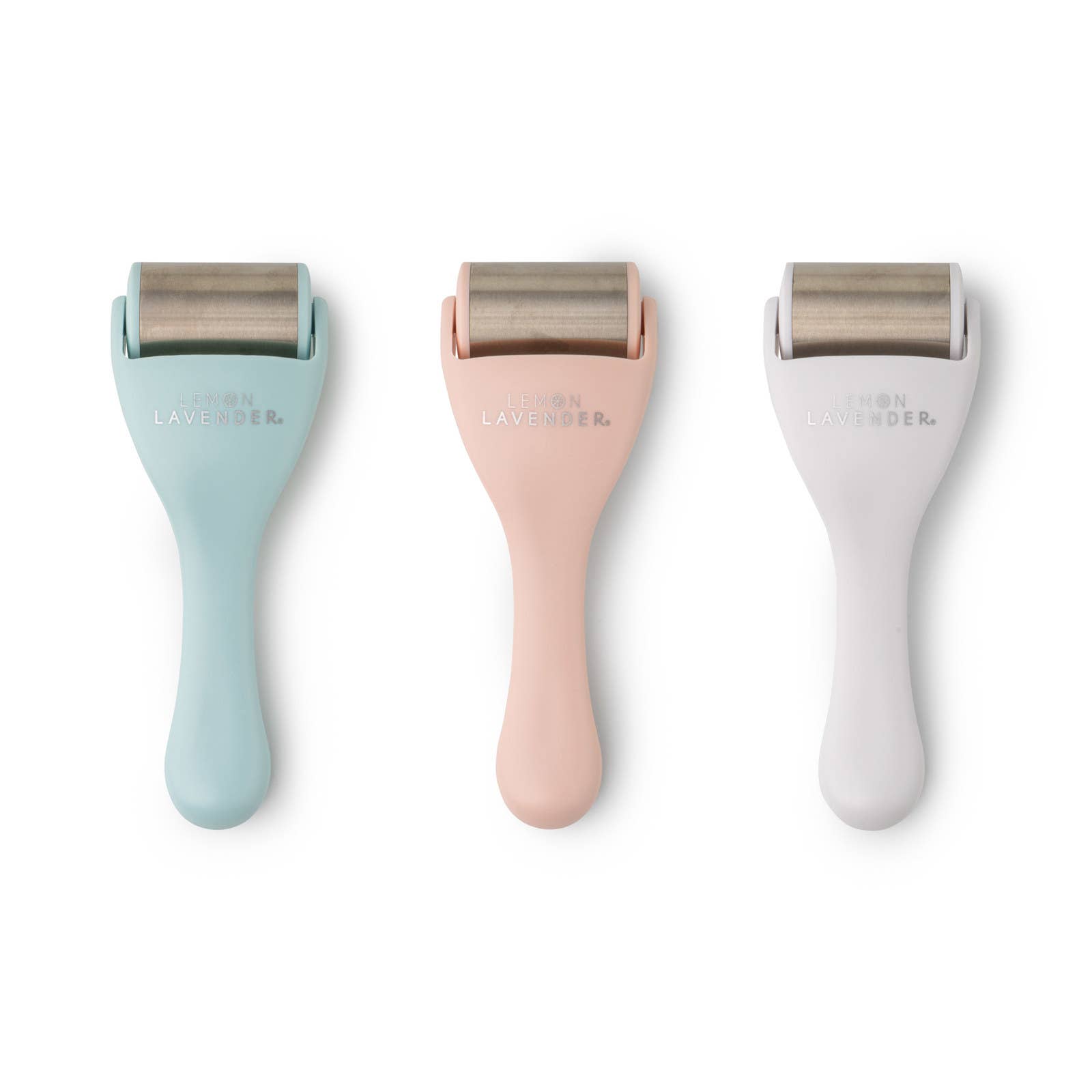 Three skin care rollers with different colored handles on a white background