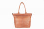 Brown leather tote bag on a white background