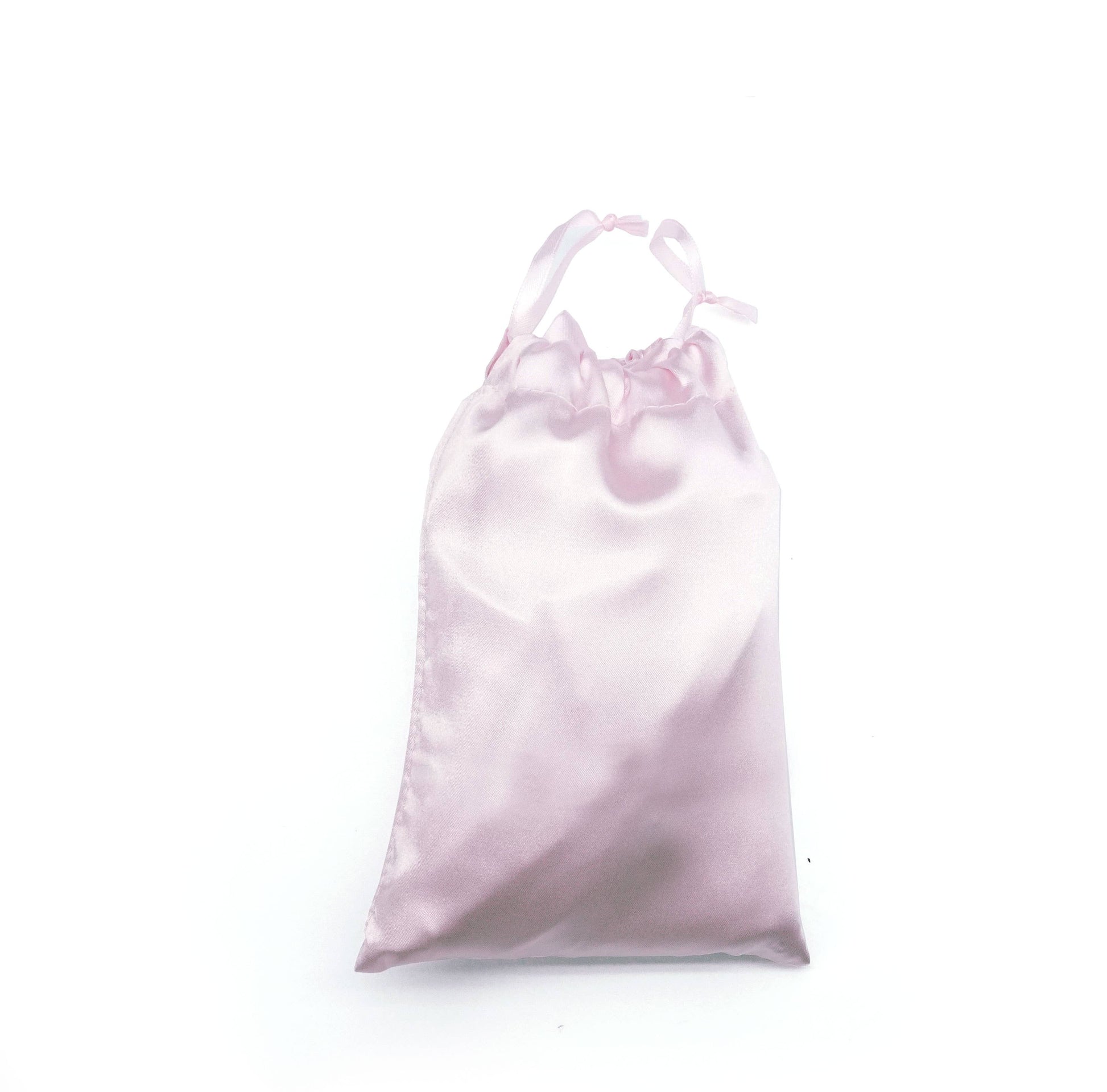 Light pink satin drawstring bag on a white background