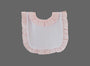 A light pink and white baby bib with ruffled trim, shown flat against a solid gray background.