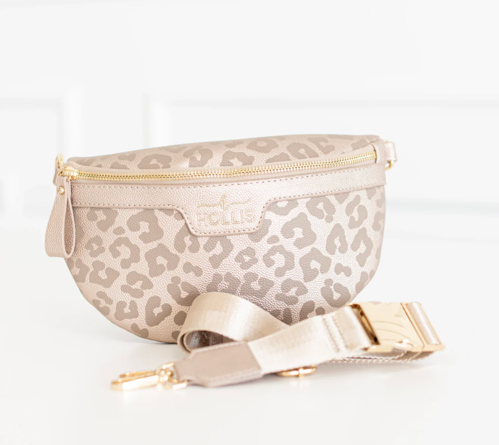 Leopard print fanny pack with gold accents on a white background