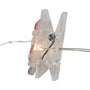A clear plastic clothes clip with a warm white LED light glowing from within, attached to a thin wire string, shown against a plain white background.