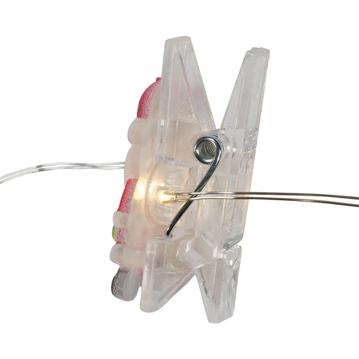 A clear plastic clothes clip with a warm white LED light glowing from within, attached to a thin wire string, shown against a plain white background.