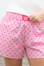 Girls' light pink polka-dot shorts with elastic waist and side pockets