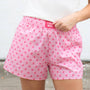 Girls' light pink polka-dot shorts with elastic waist and side pockets