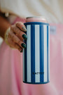 Blue striped can insulator with navy trim and pink top, held in hand