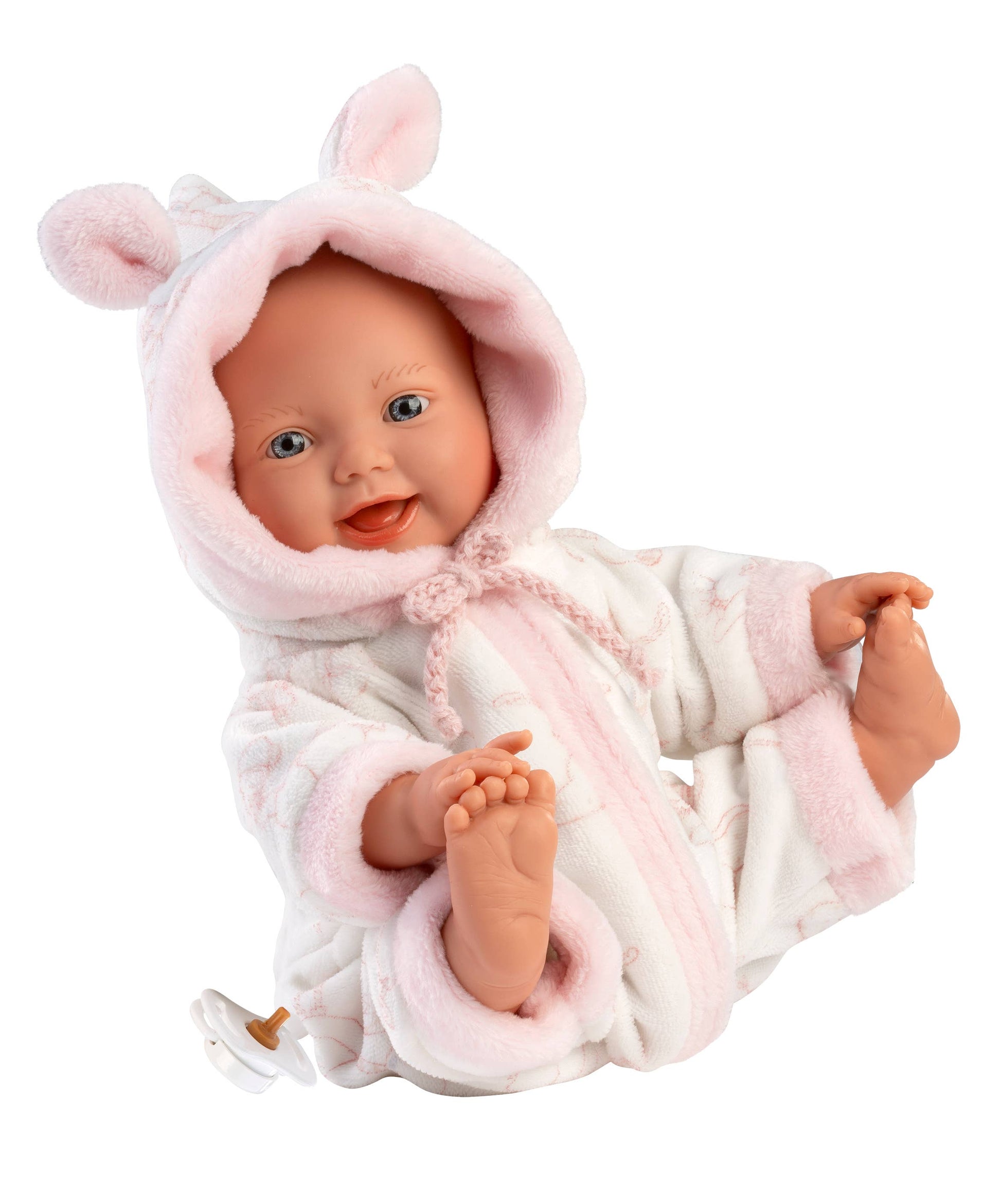 Baby doll in a pink bunny costume on a white background
