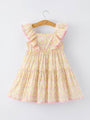Floral dress on a hanger against a light gray background