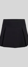 Black pleated skirt on a light gray background