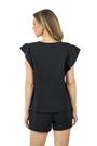 Woman wearing a black top and shorts set on a white background