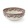 Decorative ceramic bowl with brown floral pattern on a white background