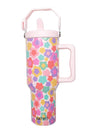 Colorful floral-patterned water bottle with pink handle on a white background