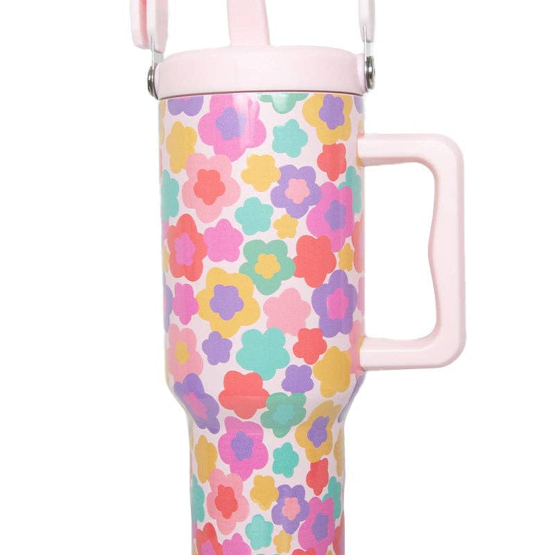 Colorful floral-patterned water bottle with pink handle on a white background